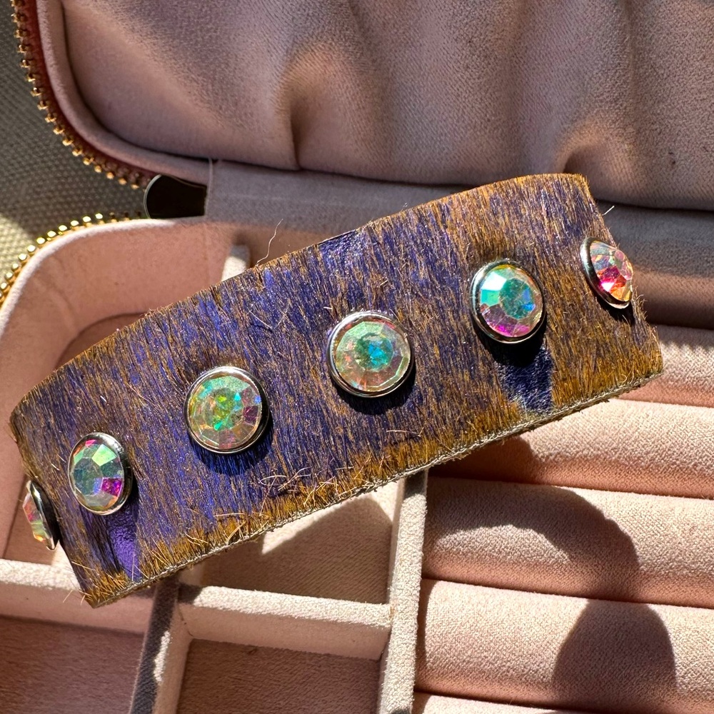 Metallic purple hair on hide leather cuff with 7 iridescent stones